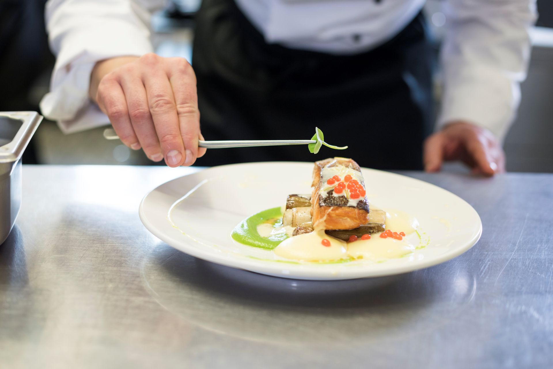chef-decorating-a-meal-made-of-fish-2024-12-05-17-56-09-utc