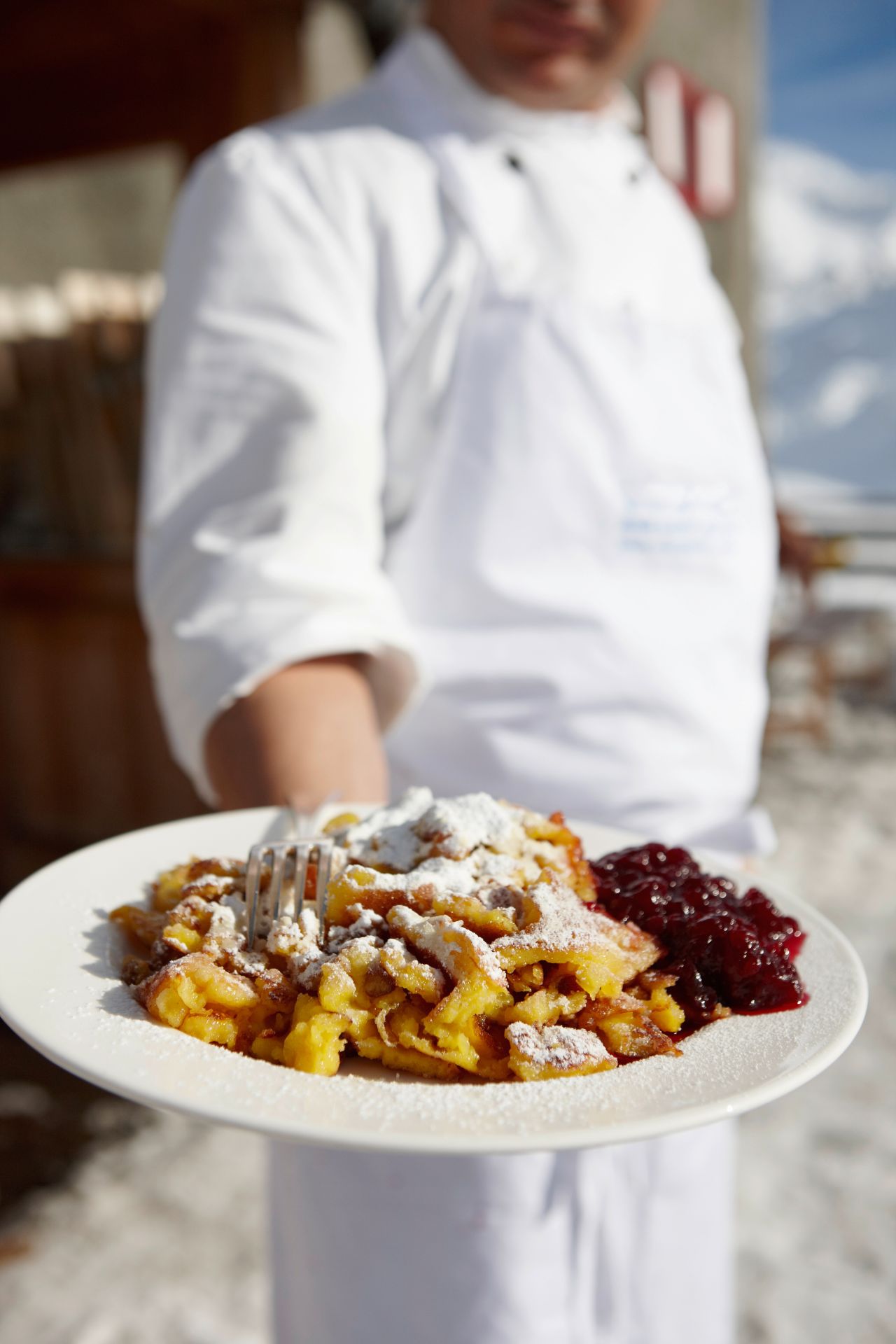 chef-offering-plate-of-food-2024-11-03-07-14-52-utc